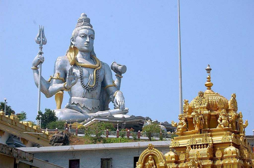 123 feet Lord Shiva statue at Murudeshwar Temple Karnataka with temple structures in foreground